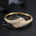 A Minimalist Gold Snake Style Bracelet Embedded With Zirconia. - Image 2