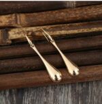Golden Teardrop Earrings - Image 2