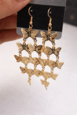 Golden Flutter Butterfly Cascade Earrings - Image 2