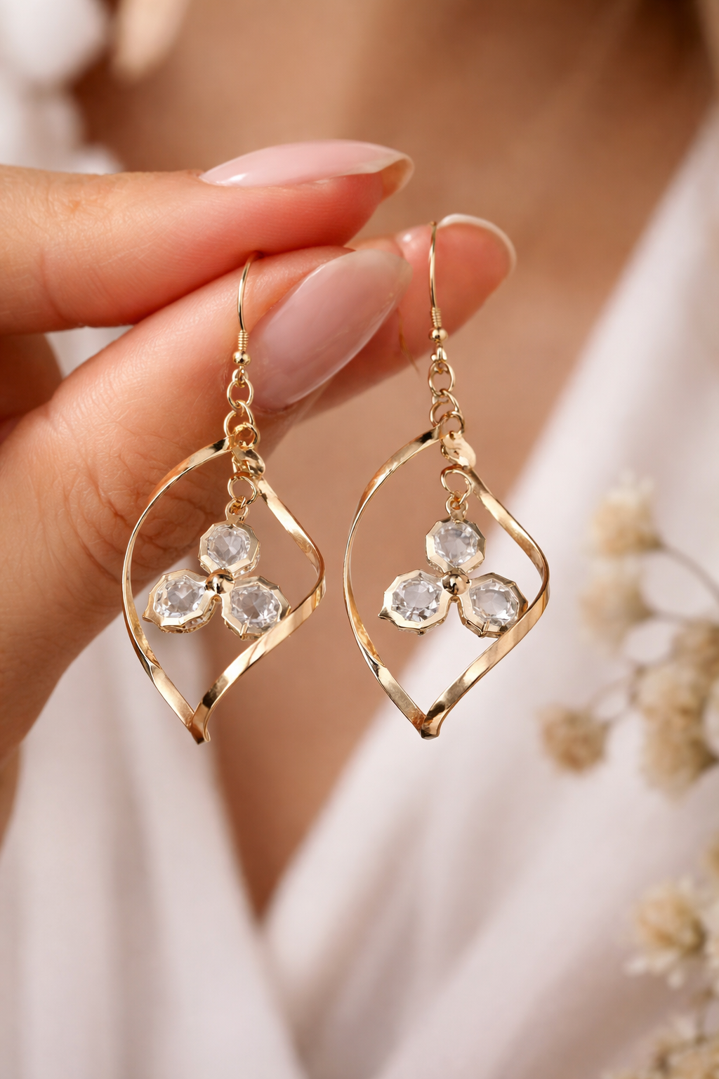 NPEV-2 Crystal Glow Elegant Gold-Tone Twisted Teardrop Crystal Drop Earrings - Image 1